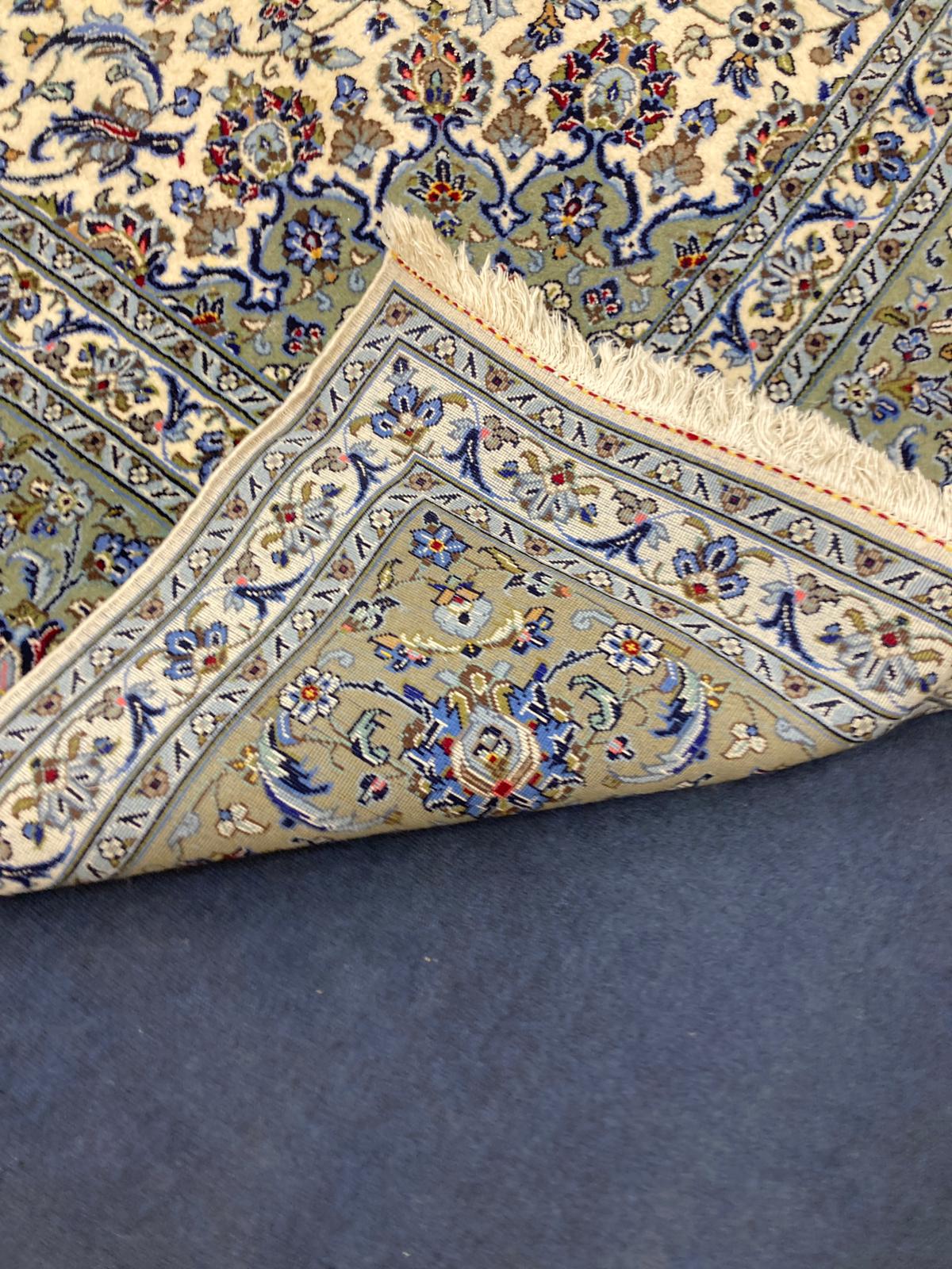 A North West Persian ivory ground carpet, 350 x 250cm